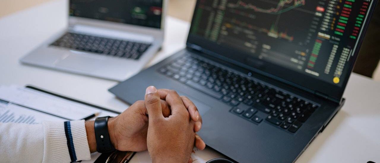 a man looking at laptop - GIBX Option Contract